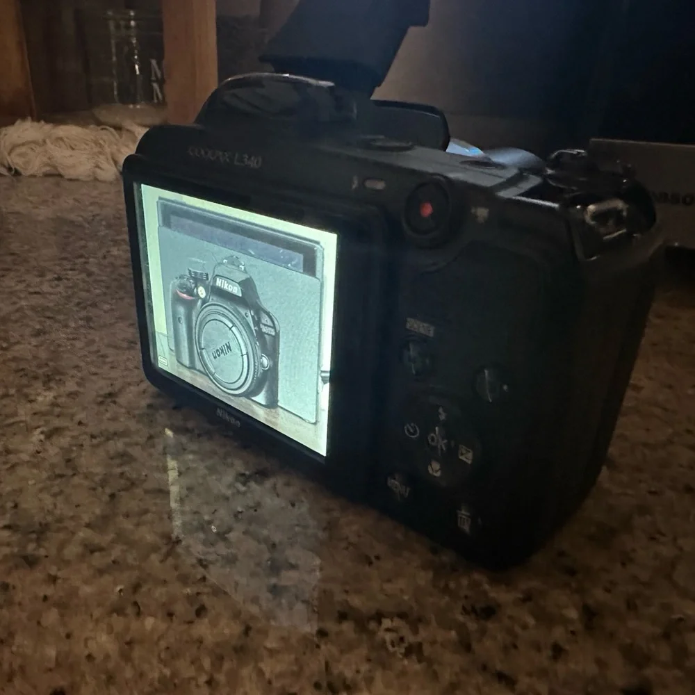Great camera in great shape. 28x optical zoom wide lens. 20.2Mp point and shoot